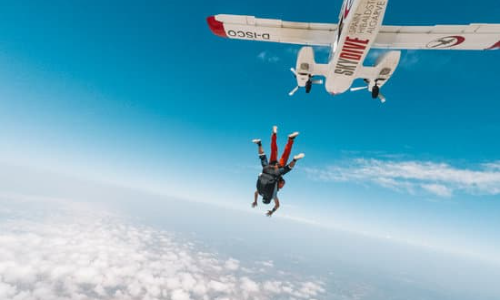 A person leaping out of a plane